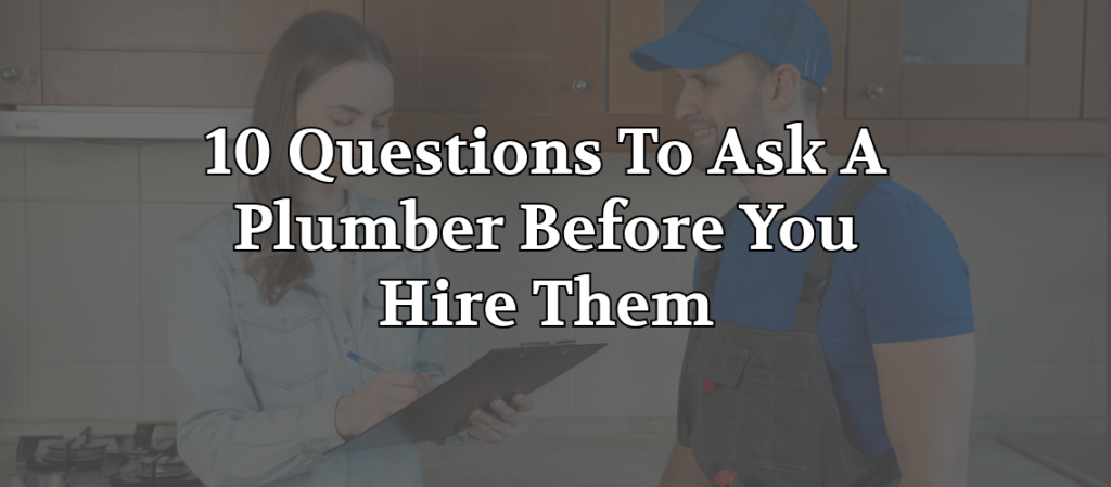 Homeowner reviewing paperwork with a professional plumber during an in-home consultation before hiring plumbing services.