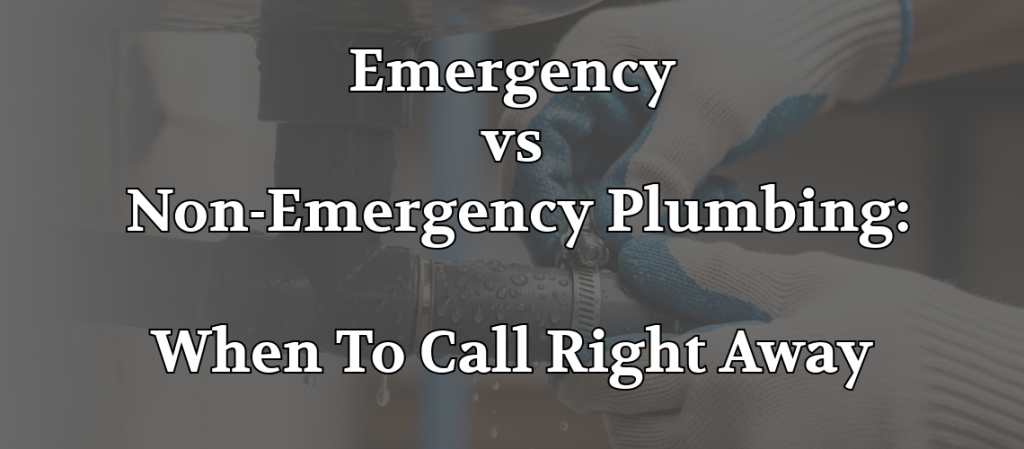 Plumber repairing a leaking drain pipe beneath a sink during an emergency plumbing service call.