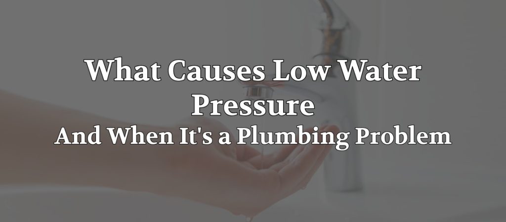 Water flowing from a household faucet into a person’s hand, illustrating common causes of low water pressure.